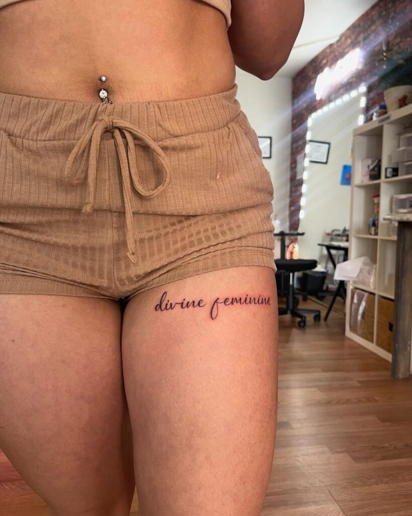 Short Script Thigh Tattoo