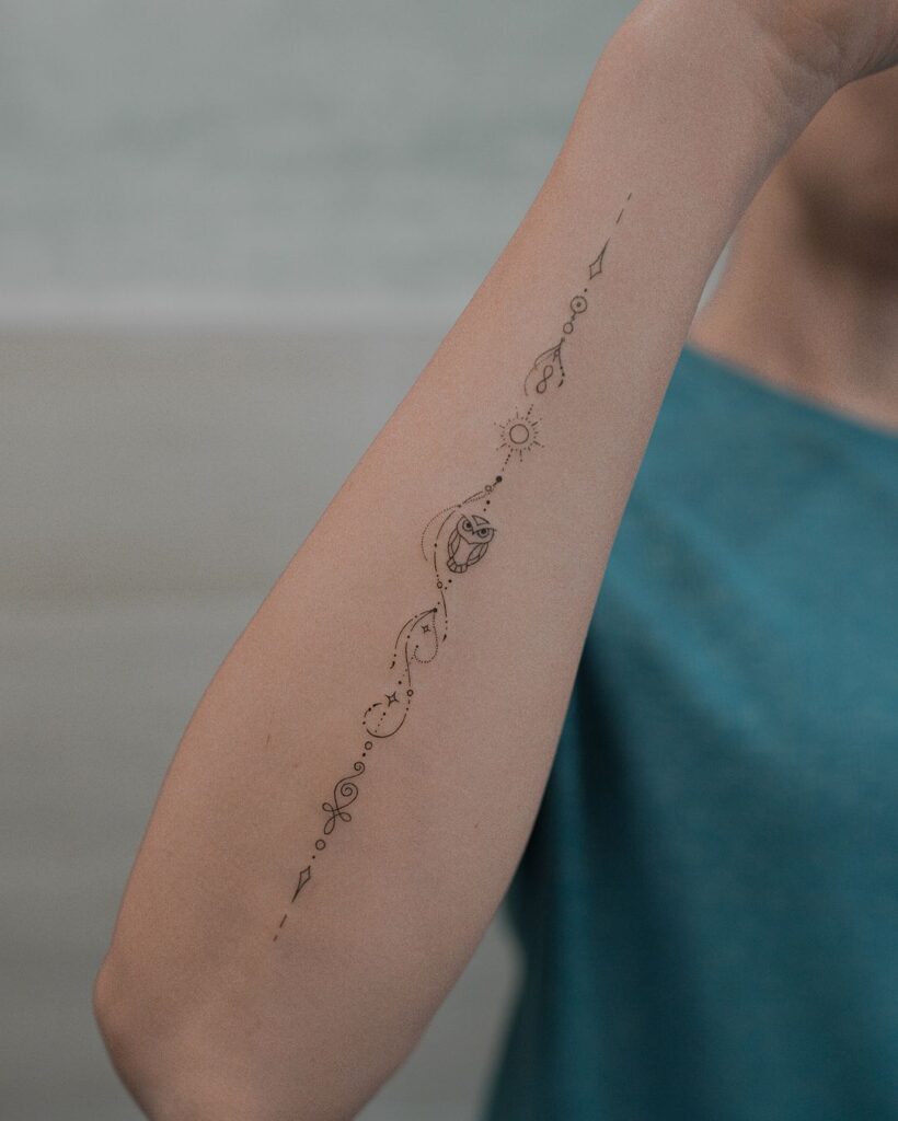 Side Forearm Symbols Tattoo