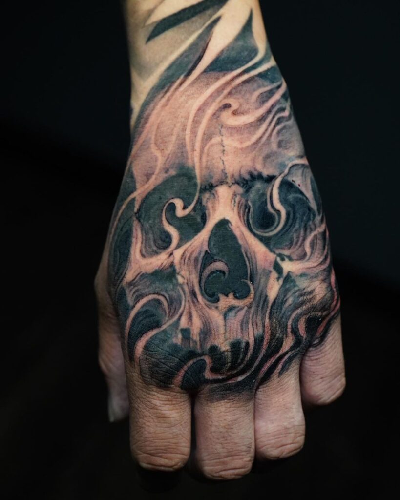 Smoke Skull Hand Tattoo