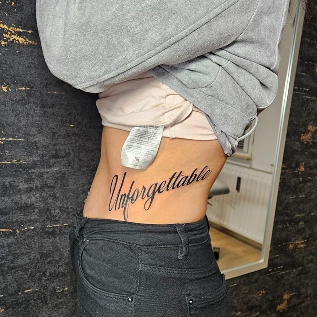 Unforgettable Side Stomach Script Tattoo