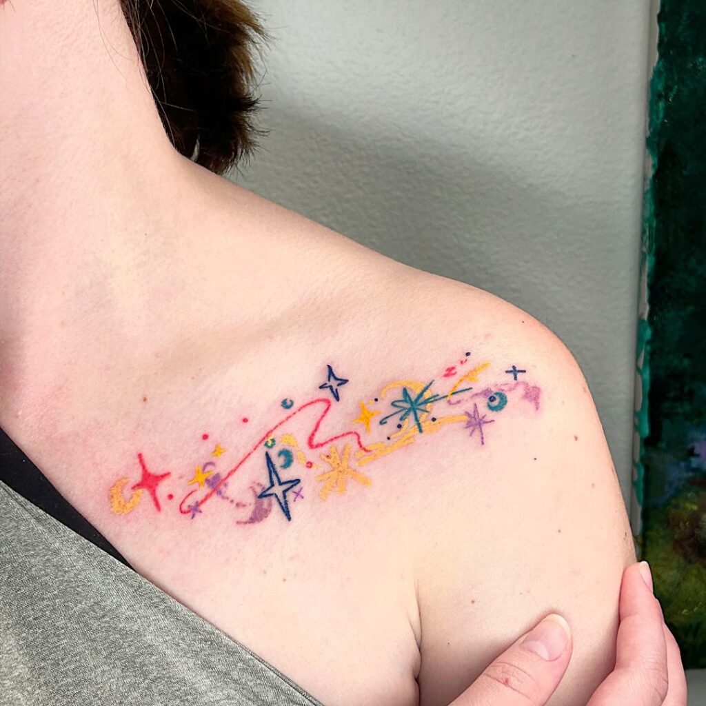 Whimsical And Colorful Collarbone Tattoo