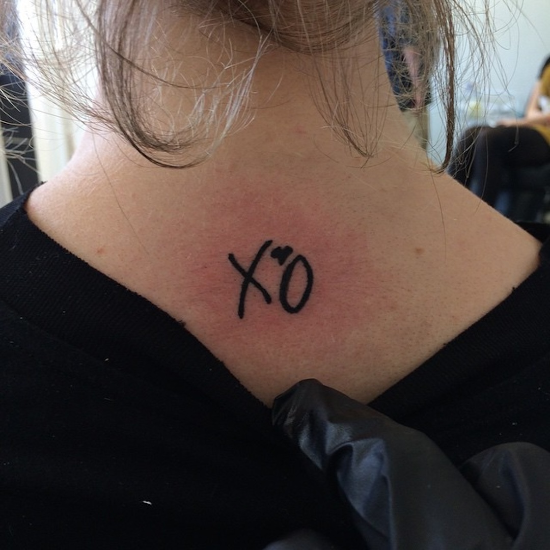 XO Tatuagem nas costas