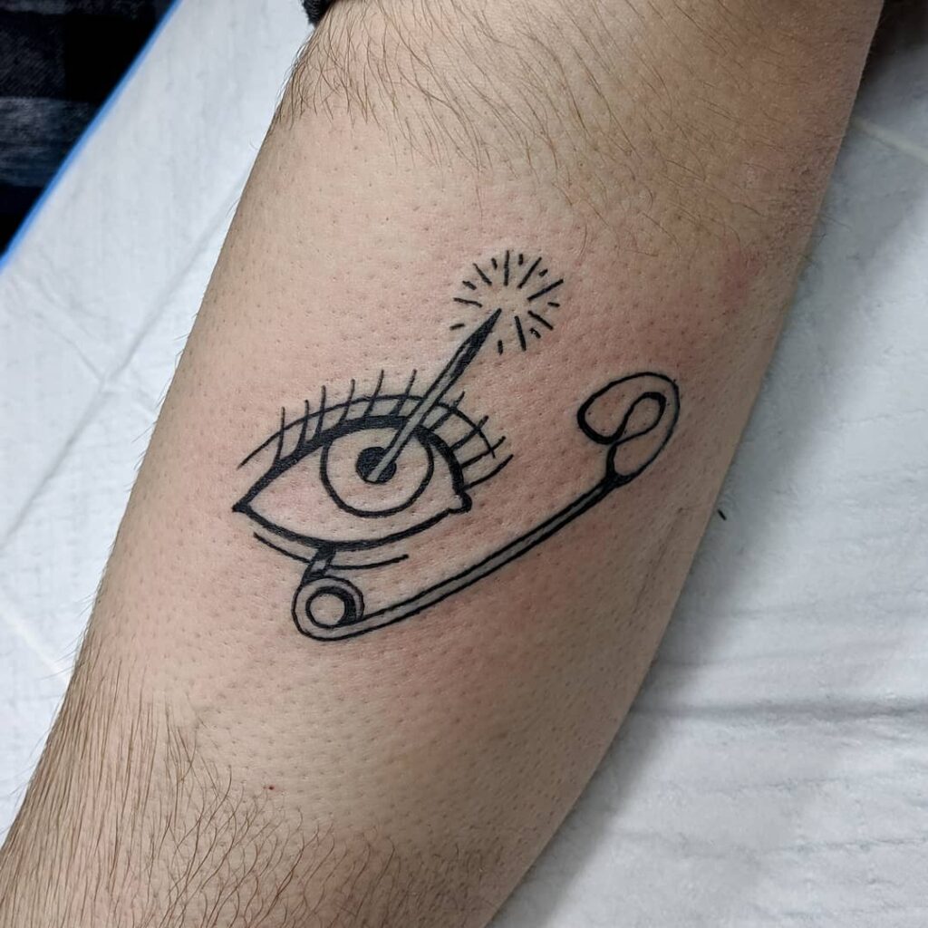 Safety Pin And Eye Tattoo