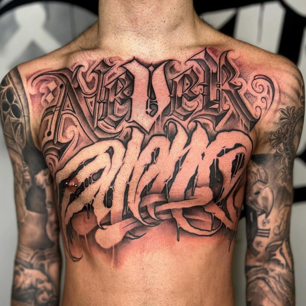 Never Alone Chest Tattoo Lettering