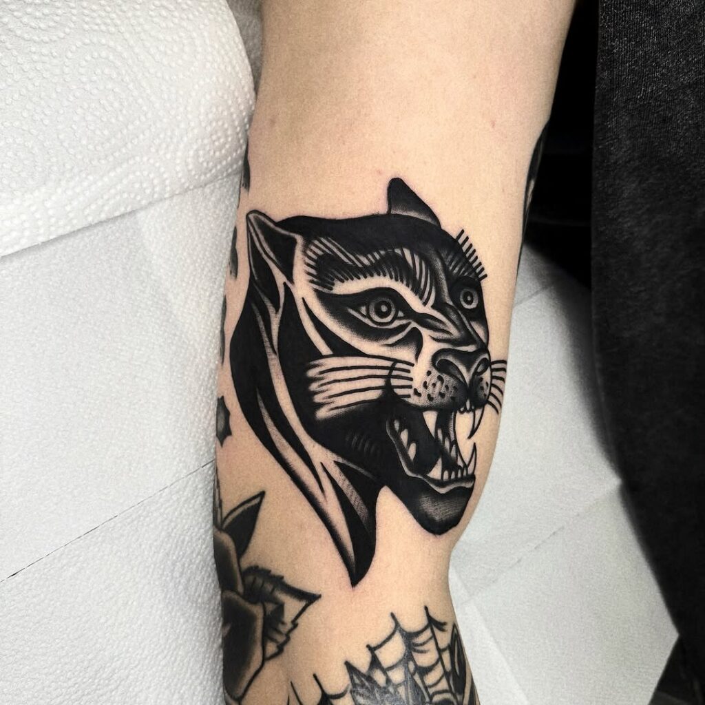 Traditional Black And Grey Panther Tattoo