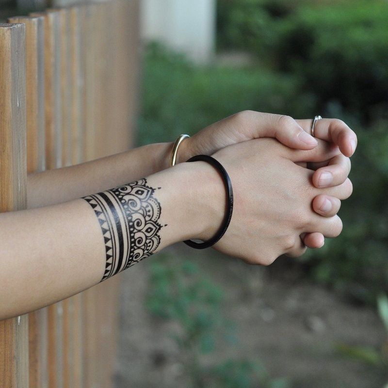 Henna-Inspired Wrist Wrap Tattoo