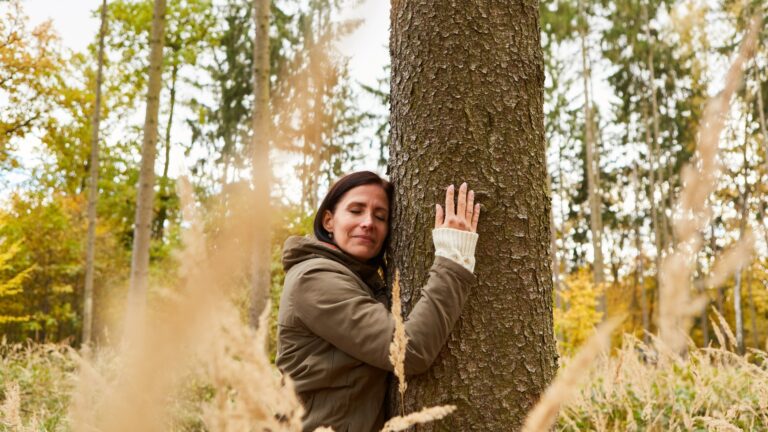 Woman hugging a tree