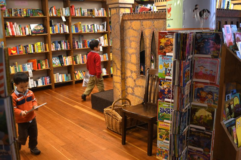 Take them to a bookstore or toy shop with a set budget