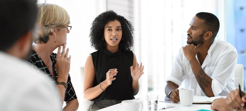 Talking over others to appear knowledgeable