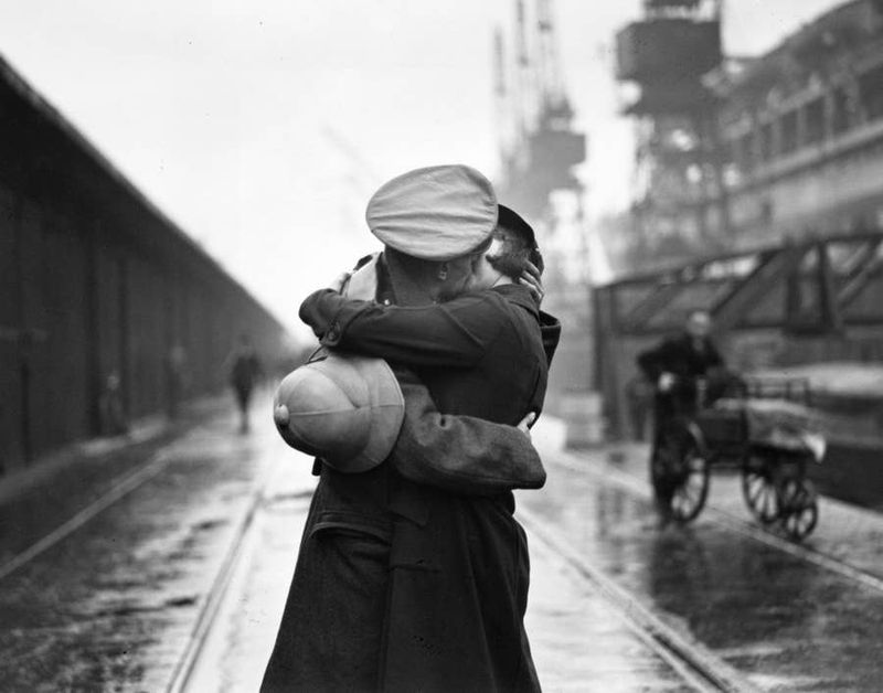 Couple Embracing at a Train Station