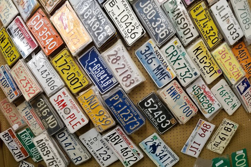 Old license plates nailed to the wall