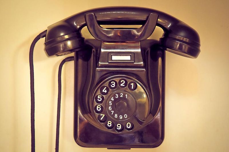 The whir and thump of a rotary dial telephone