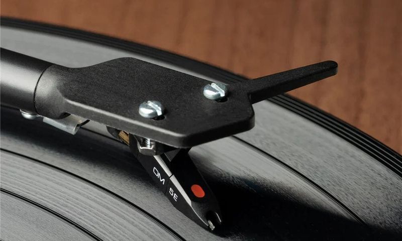 The hiss and pop of a needle skipping on a record