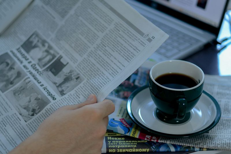 Reading newspapers over morning coffee