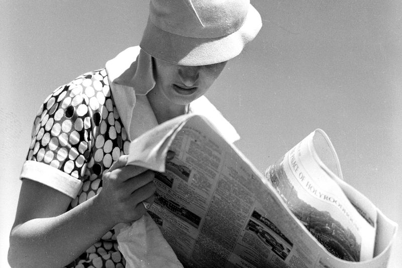 Reading the newspaper front to back