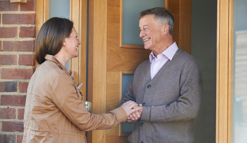 Greeting neighbors with a smile