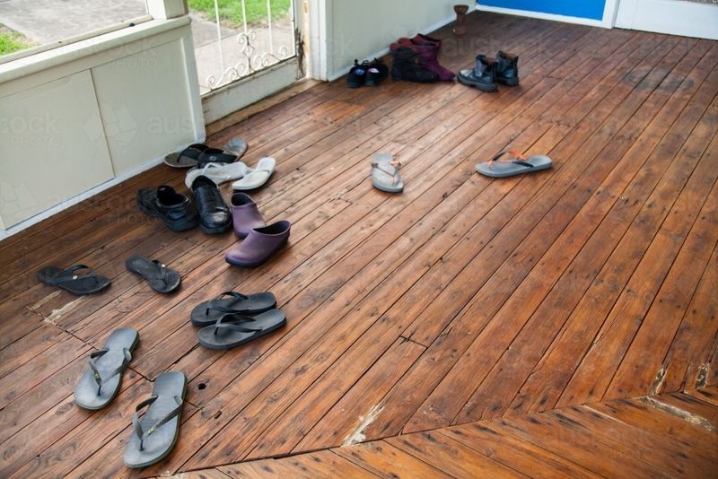 Shoes Scattered Across the Entryway