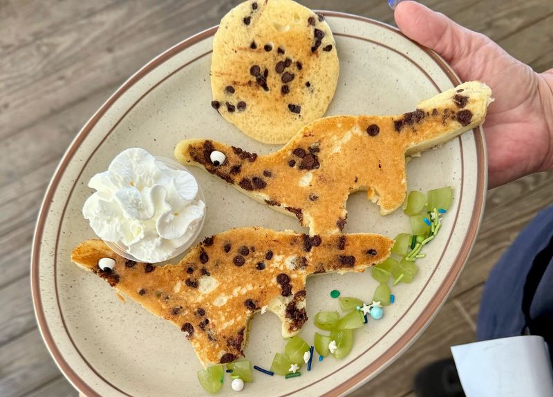Cooking pancakes shaped like dinosaurs