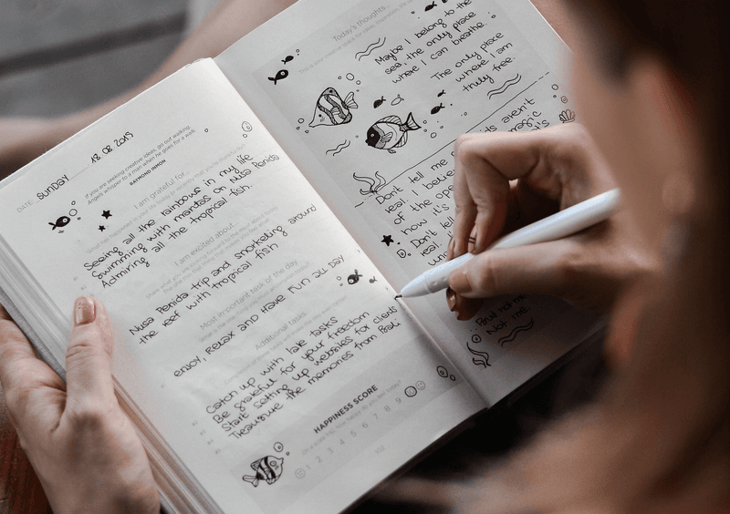 Writing down thoughts to clear mental clutter