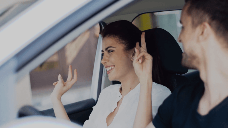 Singing badly in the car together