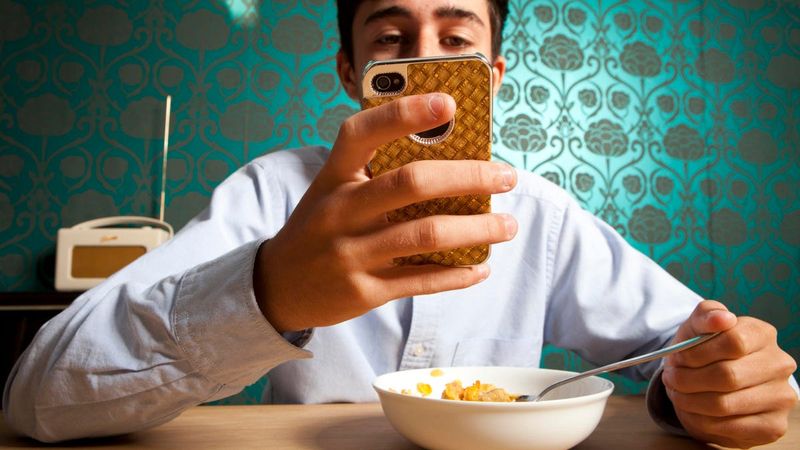 Keeping their phone on silent during meals